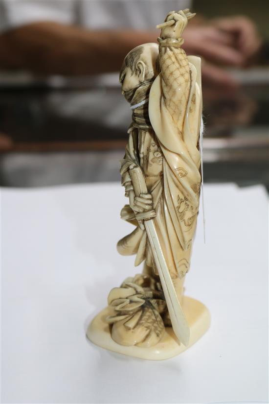 A Japanese ivory okimono of a warrior